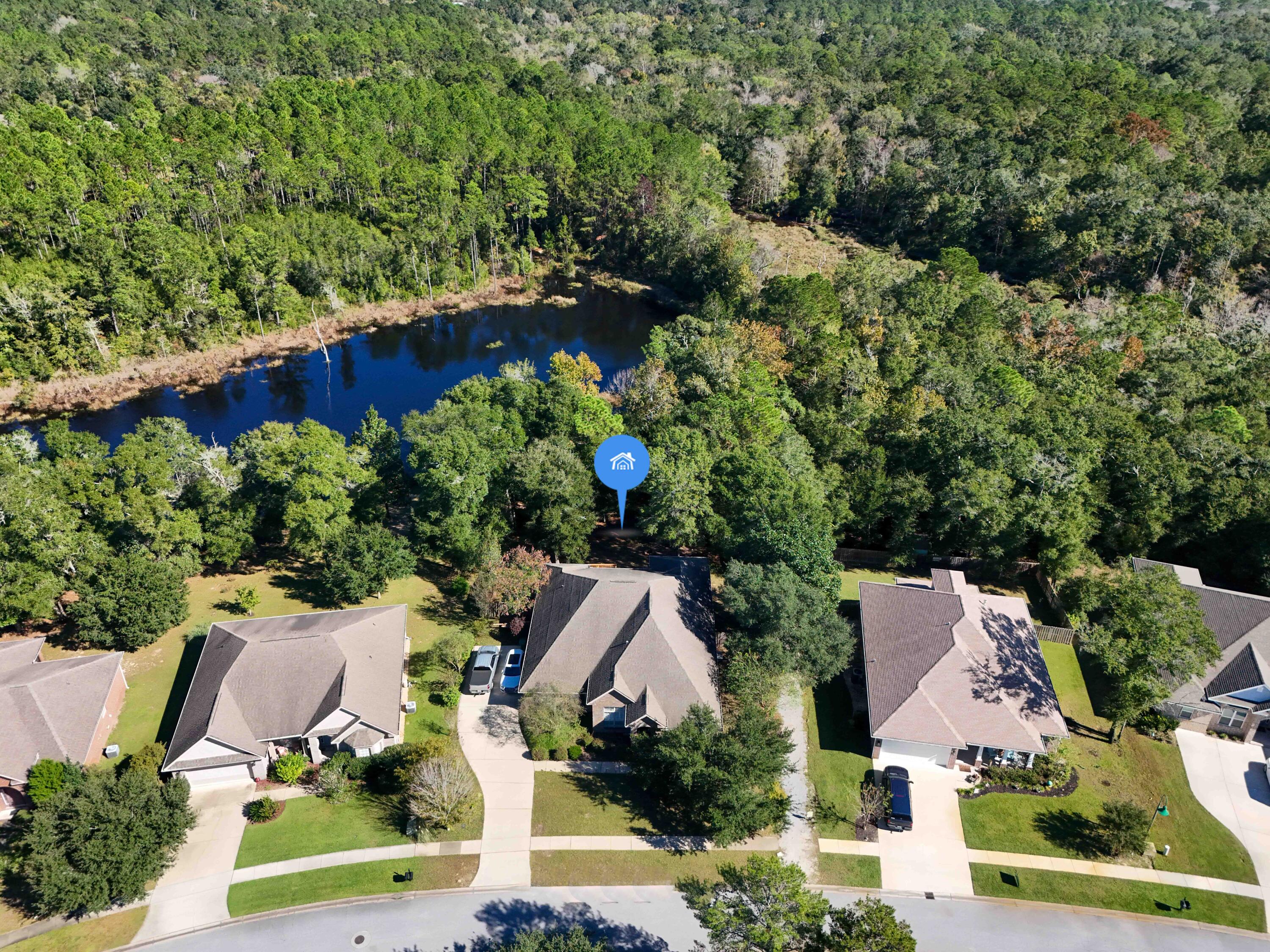 446 Mango Lane Freeport, FL 32439 - Photo 4 of 74 an aerial view of a house with a yard and lake view