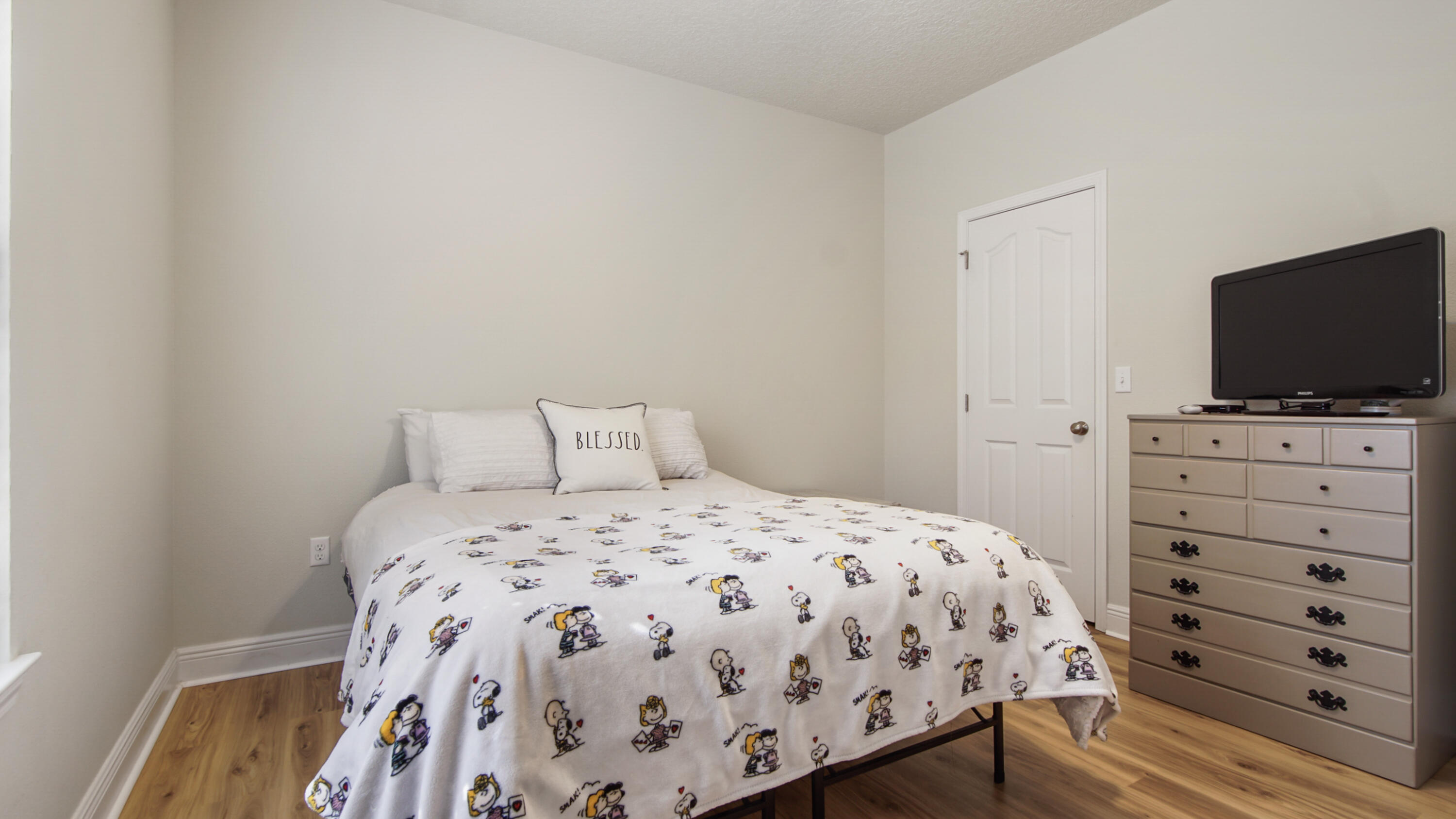 446 Mango Lane Freeport, FL 32439 - Photo 41 of 73 a bedroom with a bed and a flat tv screen on dresser