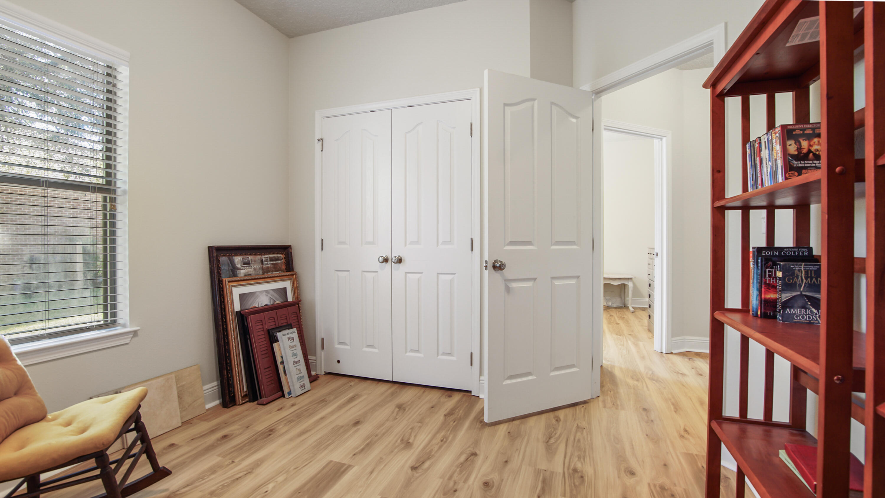 446 Mango Lane Freeport, FL 32439 - Photo 44 of 73 a view of an empty room with window and hardwood floor