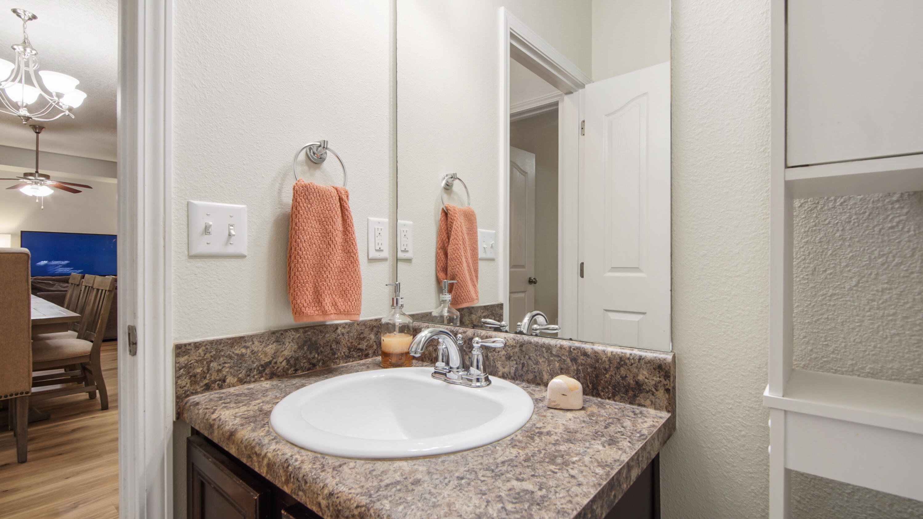 446 Mango Lane Freeport, FL 32439 - Photo 49 of 74 a bathroom with a granite countertop sink and a mirror