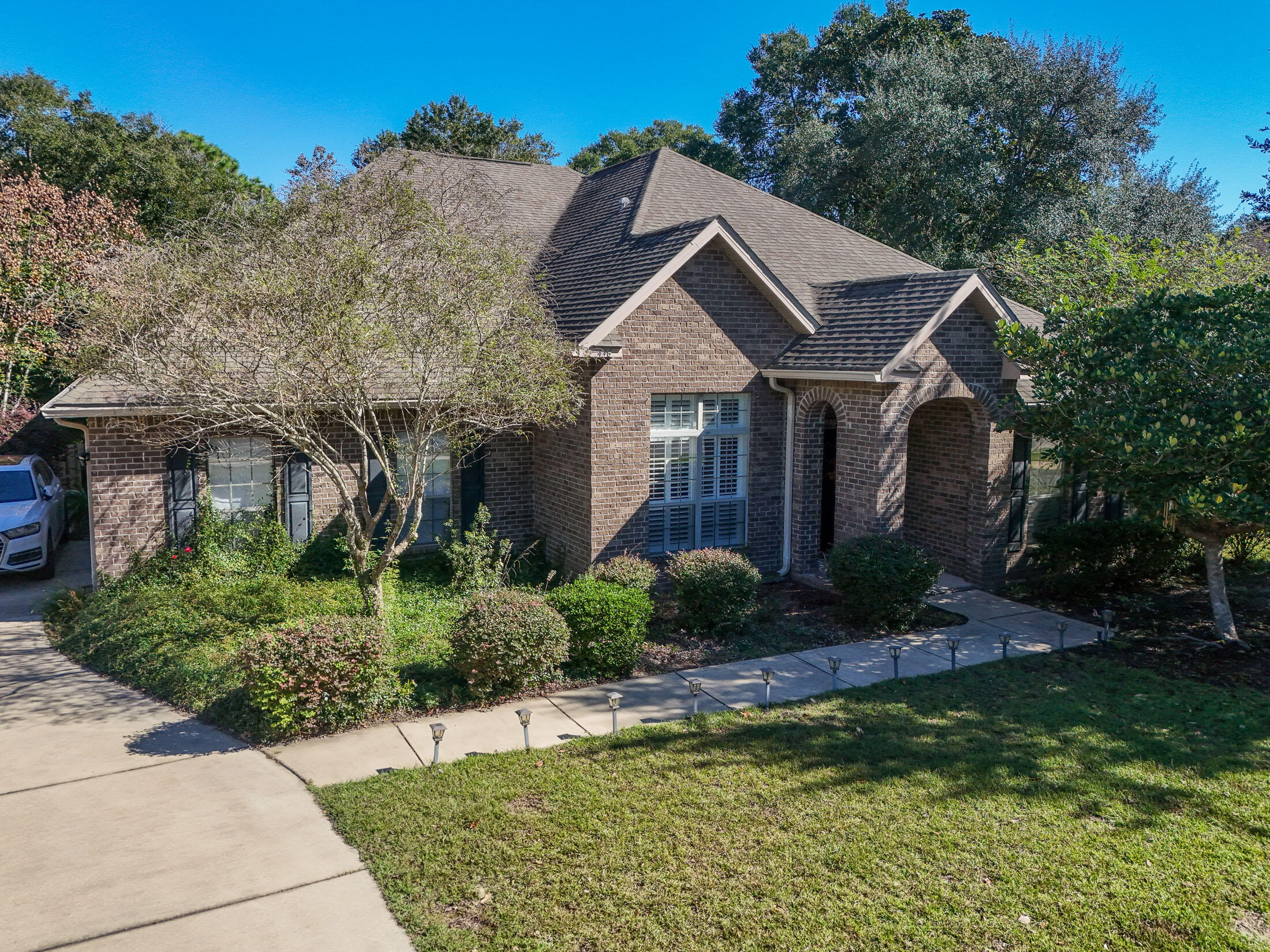446 Mango Lane Freeport, FL 32439 - Photo 51 of 73 a front view of a house with a yard