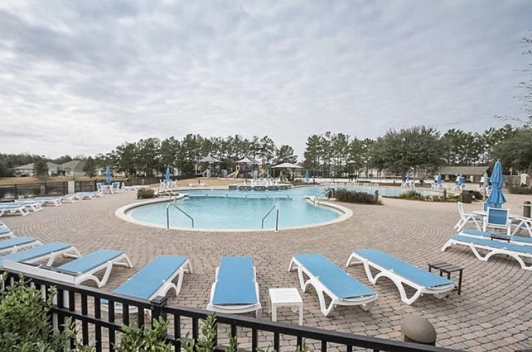 446 Mango Lane Freeport, FL 32439 - Photo 59 of 74 a view of a swimming pool with a terrace