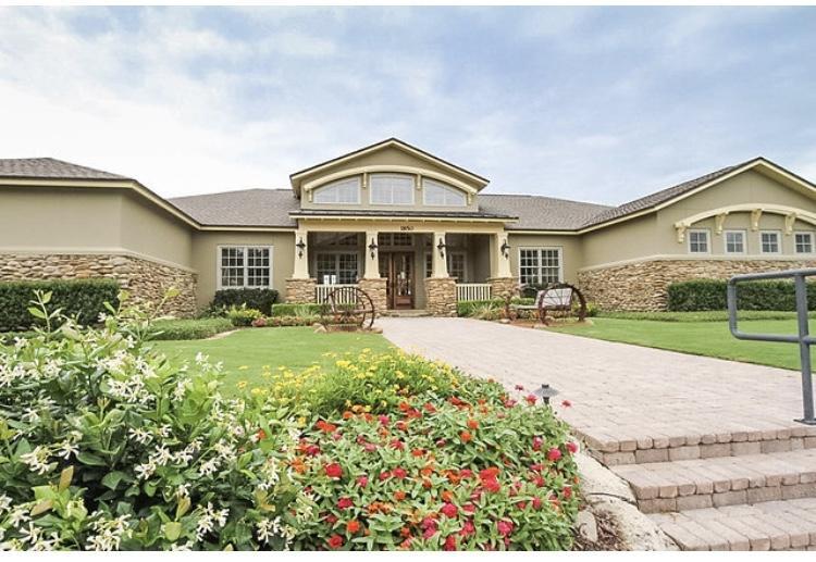 446 Mango Lane Freeport, FL 32439 - Photo 64 of 74 a front view of a house with a yard and fountain