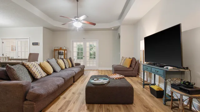 a living room with furniture and a flat screen tv