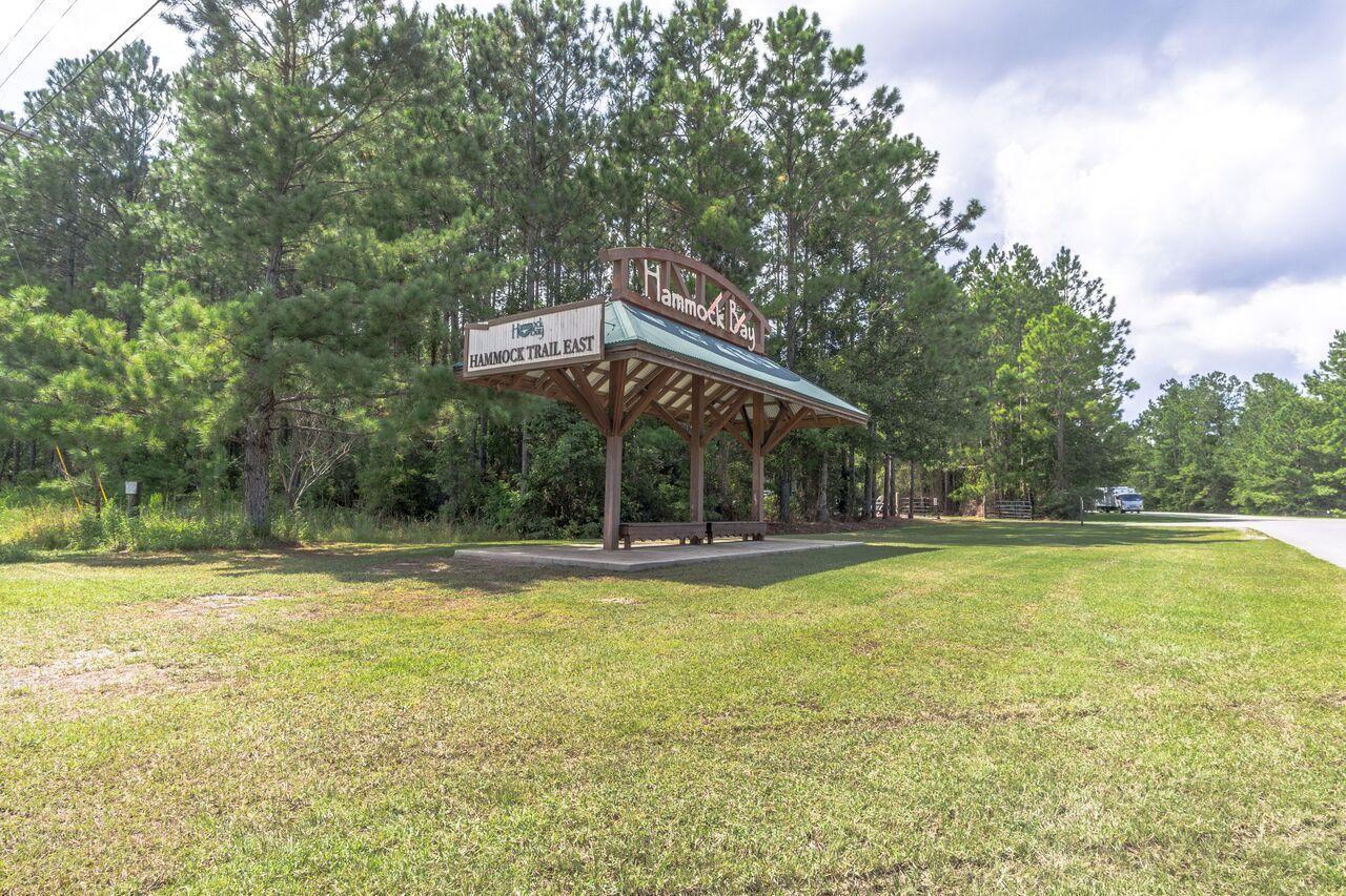 446 Mango Lane Freeport, FL 32439 - Photo 71 of 74 a view of a swimming pool with an outdoor space and seating area