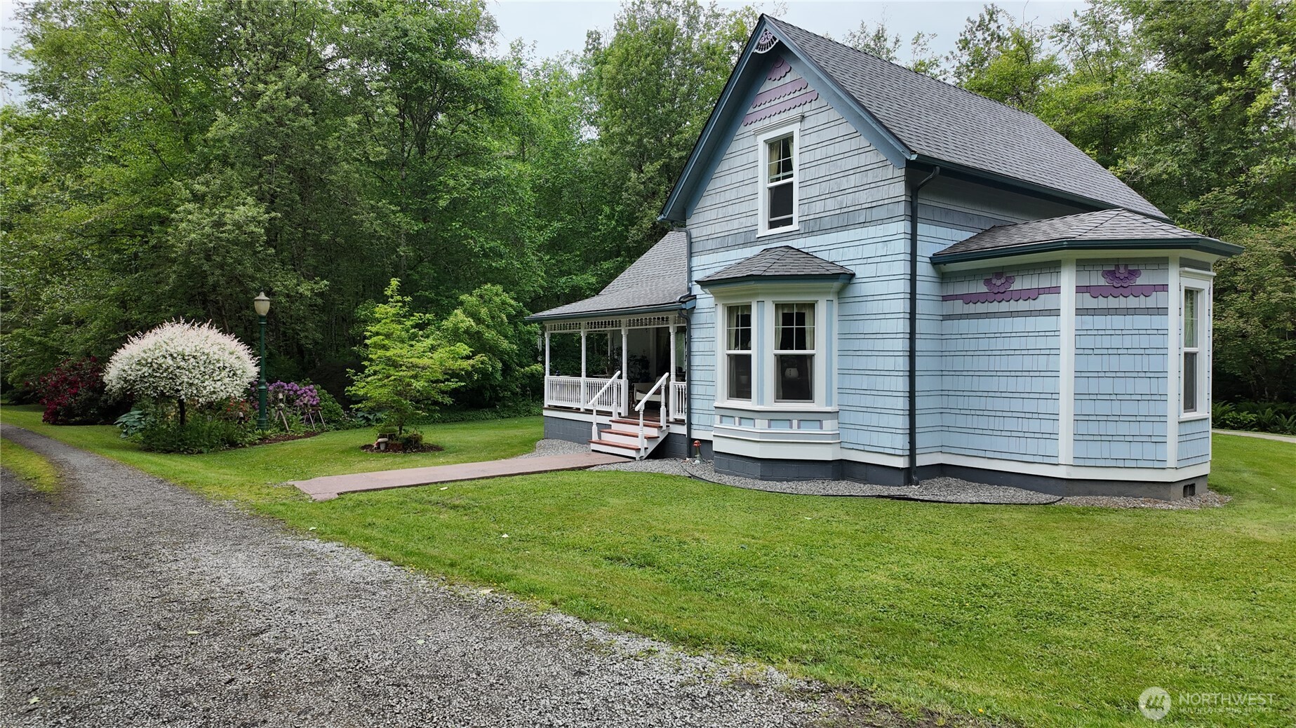 2909 Overpass Road Bow, WA 98232 - Photo 3 of 40 a view of a house with a yard and sitting area