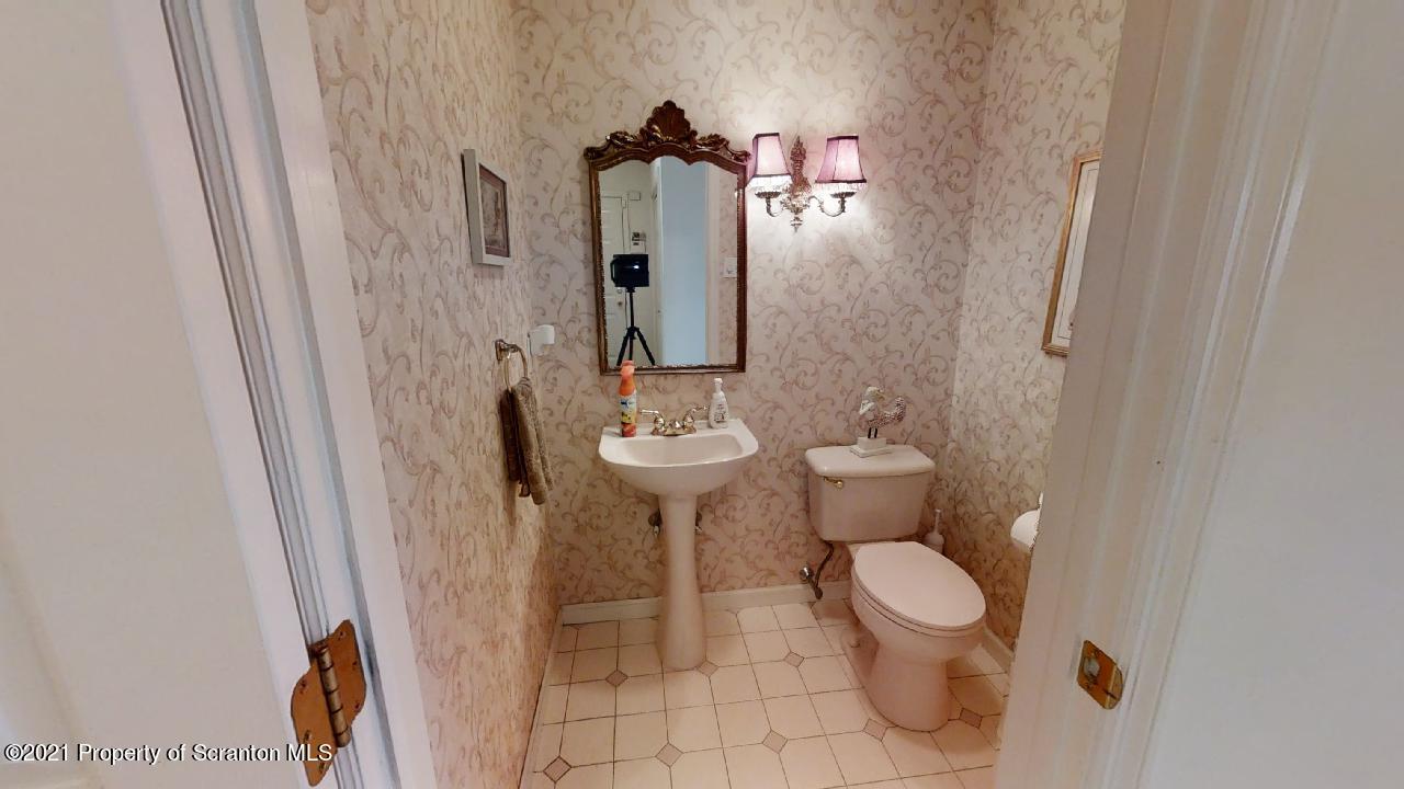 1355 Oak Drive Shavertown, PA 18708 - Photo 12 of 32 a bathroom with a toilet sink and mirror