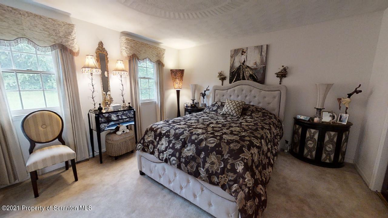 1355 Oak Drive Shavertown, PA 18708 - Photo 15 of 32 a bed room with a bed and chair