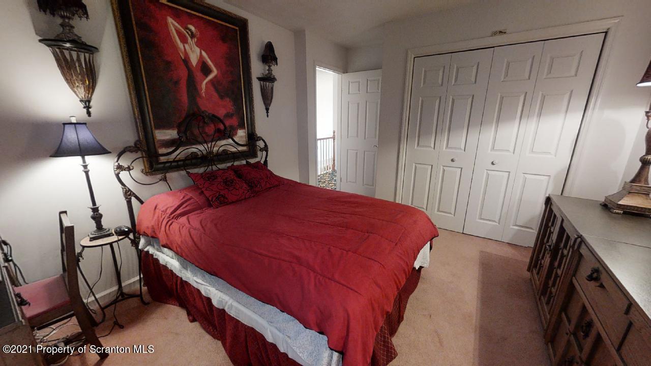 1355 Oak Drive Shavertown, PA 18708 - Photo 22 of 32 a bed room with a bed and a television