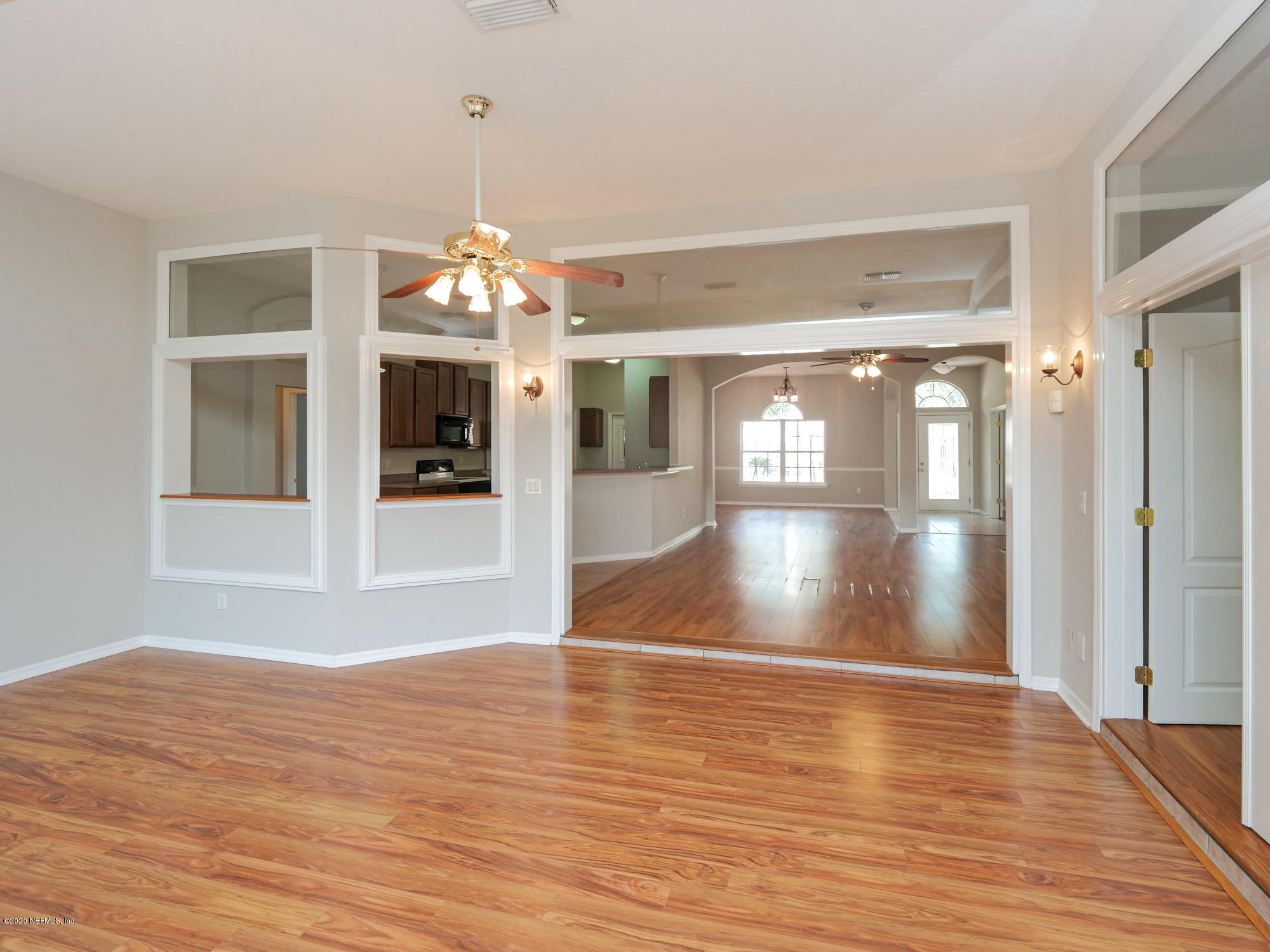 8663 Reedy Branch Drive Jacksonville, FL 32256 - Photo 15 of 33 a view of a room with wooden floor