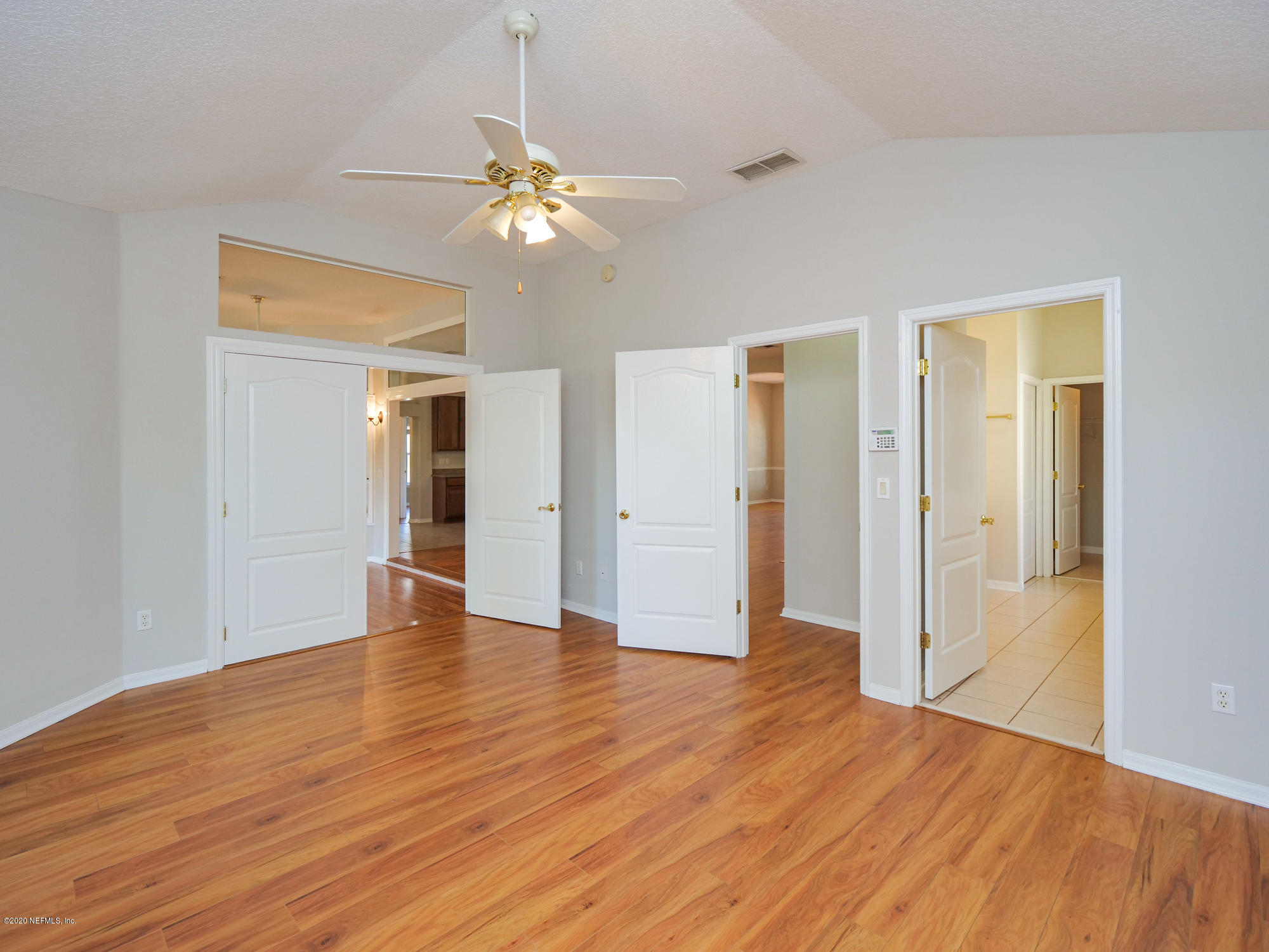 8663 Reedy Branch Drive Jacksonville, FL 32256 - Photo 18 of 33 a view of an empty room with wooden floor
