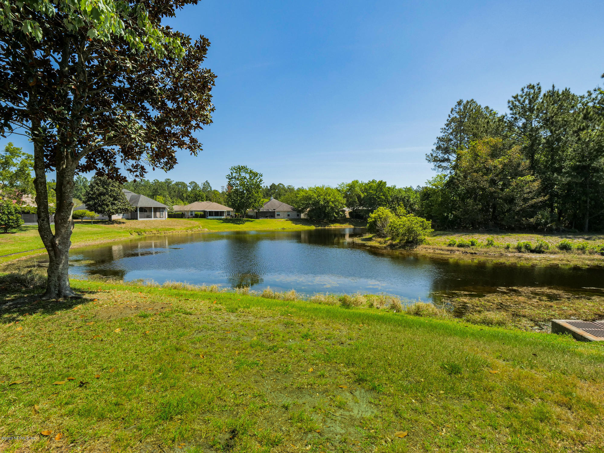 8663 Reedy Branch Drive Jacksonville, FL 32256 - Photo 29 of 33 a view of a lake with houses in the background