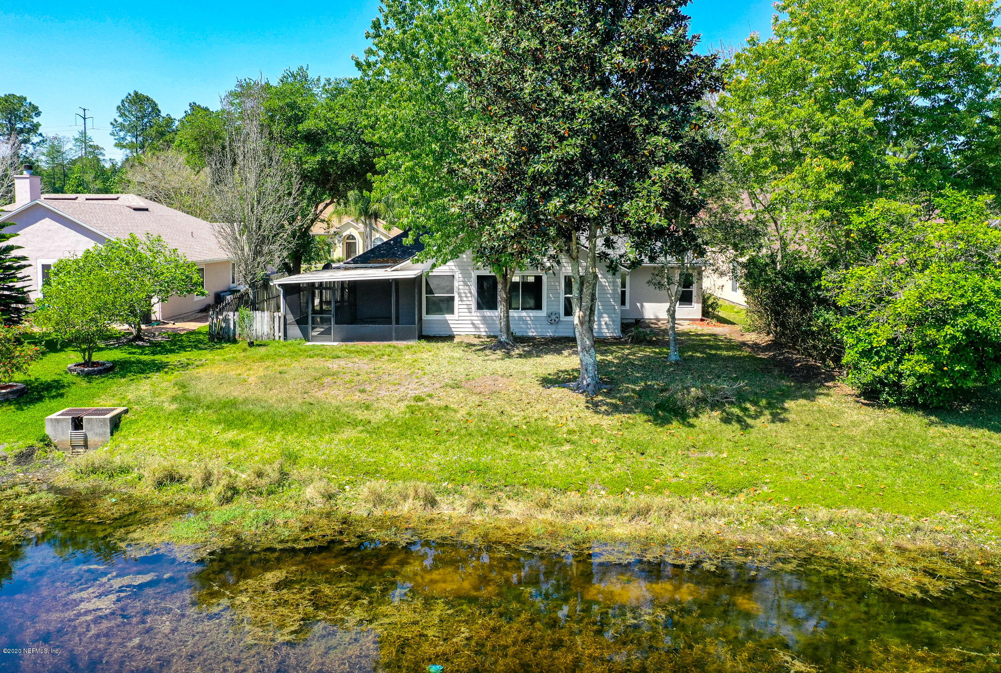 8663 Reedy Branch Drive Jacksonville, FL 32256 - Photo 31 of 33 a view of a house with a big yard and large trees