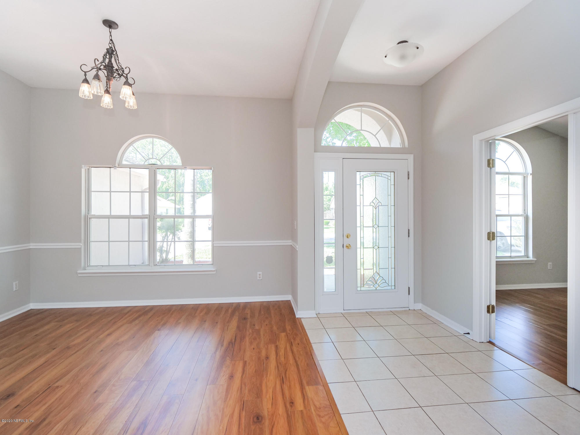 8663 Reedy Branch Drive Jacksonville, FL 32256 - Photo 4 of 33 wooden floor in an empty room with a window