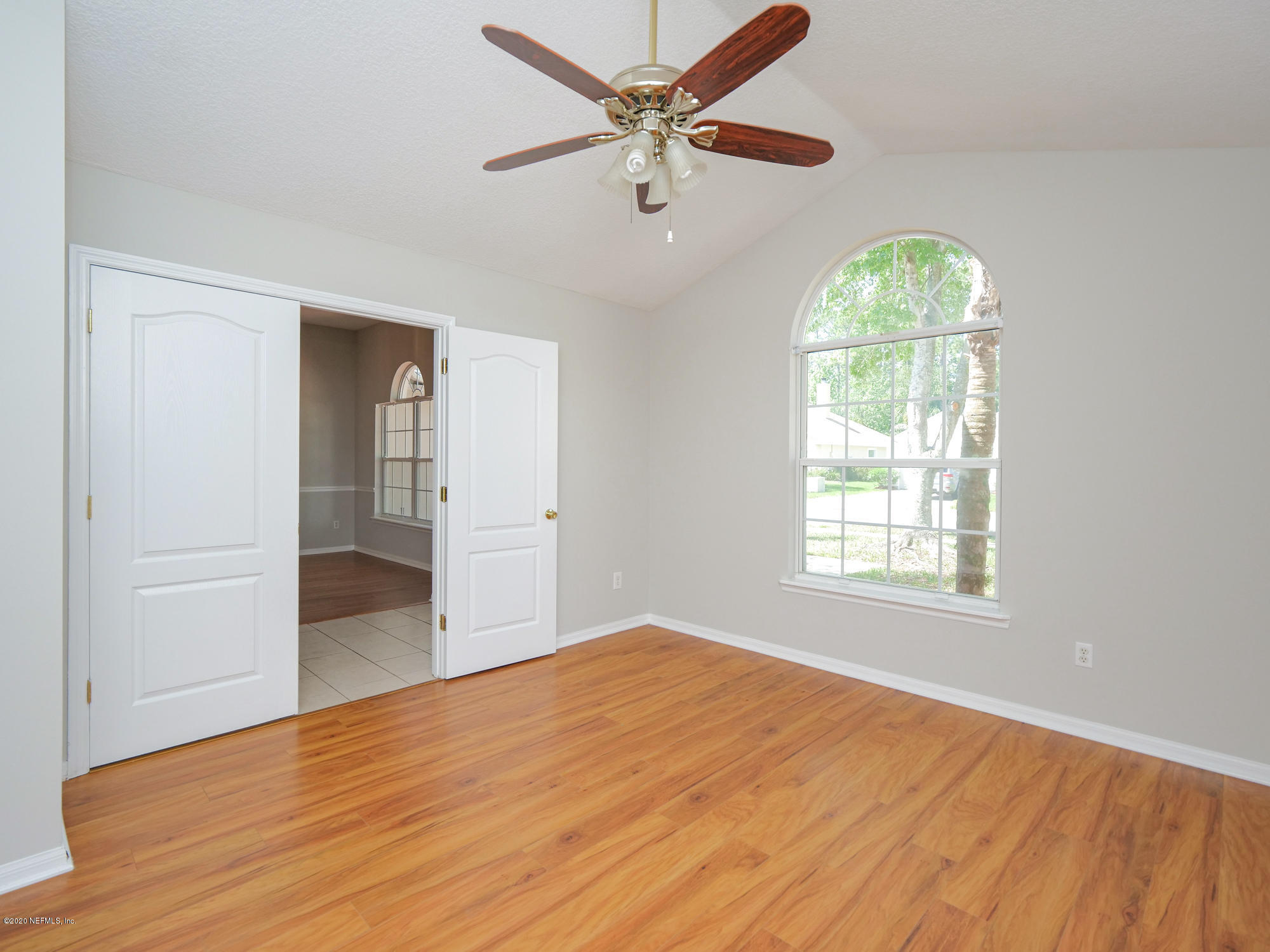 8663 Reedy Branch Drive Jacksonville, FL 32256 - Photo 5 of 33 wooden floor in an empty room with a window
