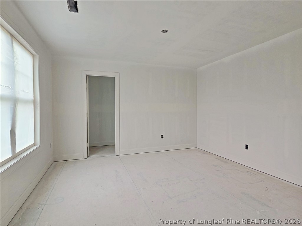 2650 Norrington Road Lillington, NC 27546 - Photo 18 of 24 an empty room with windows