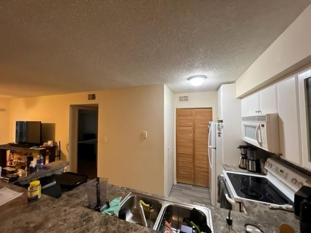 560 South Park Road, Unit 147 Hollywood, FL 33021 - Photo 14 of 16 a room with furniture a air conditioner vent and a window