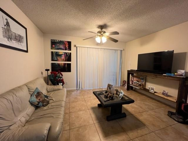 560 South Park Road, Unit 147 Hollywood, FL 33021 - Photo 2 of 16 a living room with furniture and a flat screen tv