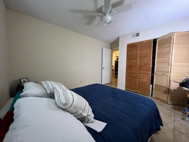 560 South Park Road, Unit 147 Hollywood, FL 33021 - Photo 5 of 16 a bedroom with a bed and a chandelier
