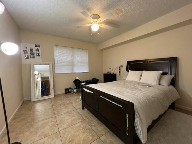 560 South Park Road, Unit 147 Hollywood, FL 33021 - Photo 6 of 16 a bed room with a bed and a chandelier