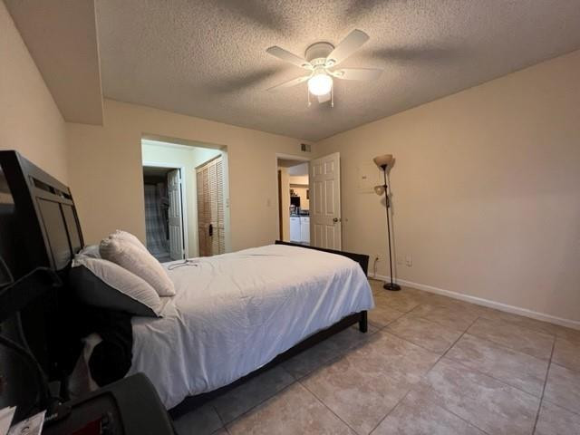 560 South Park Road, Unit 147 Hollywood, FL 33021 - Photo 8 of 16 a bed room with a bed and a chandelier