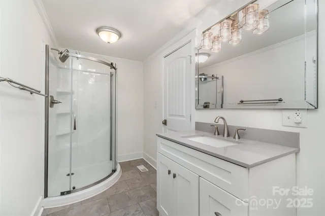 a bathroom with a shower sink and mirror