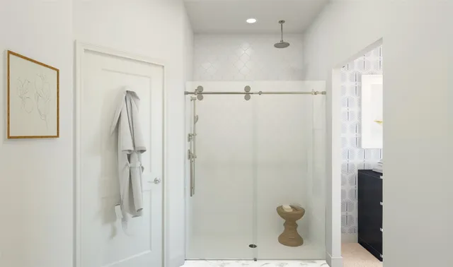 a bathroom with a sink a mirror and a shower