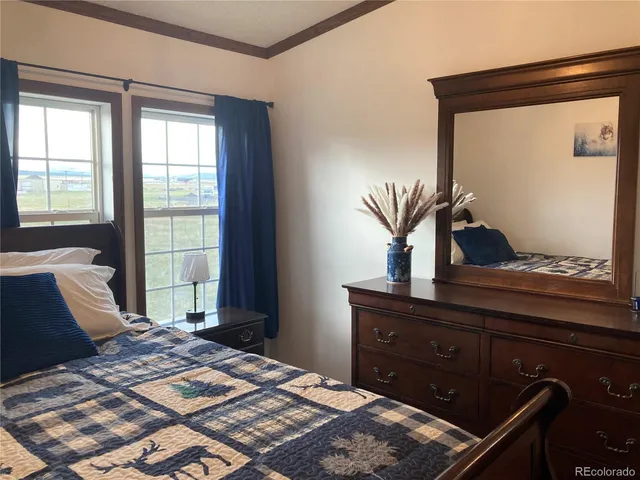 a bedroom with a bed and window