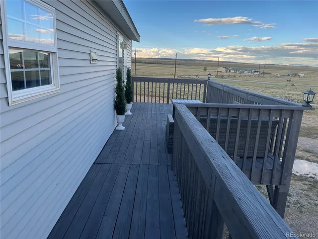 a balcony with wooden floor
