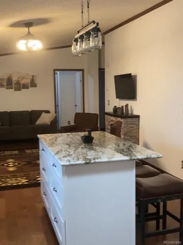 a kitchen with a counter space a sink and appliances