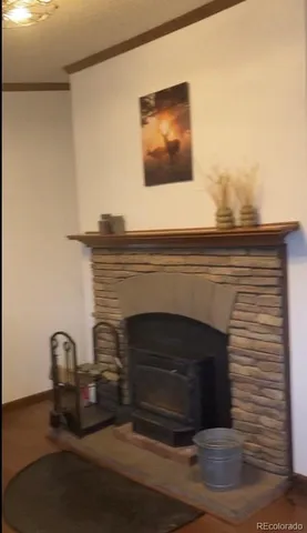 a fireplace with a vase on top of it