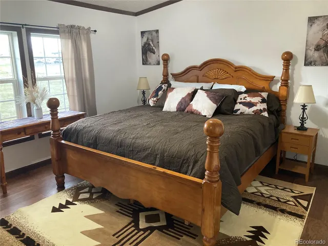 a bed room with a bed and a window