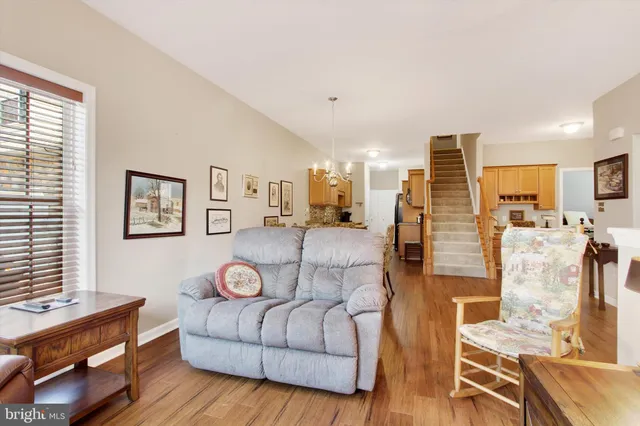 a living room with furniture and a table