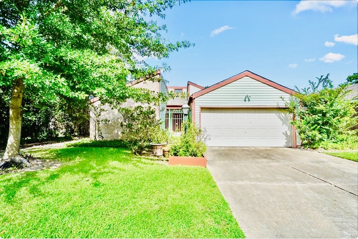 11635 Ridge Run Drive Houston, TX 77064 - Photo 1 of 20 a front view of a house with a garden and plants