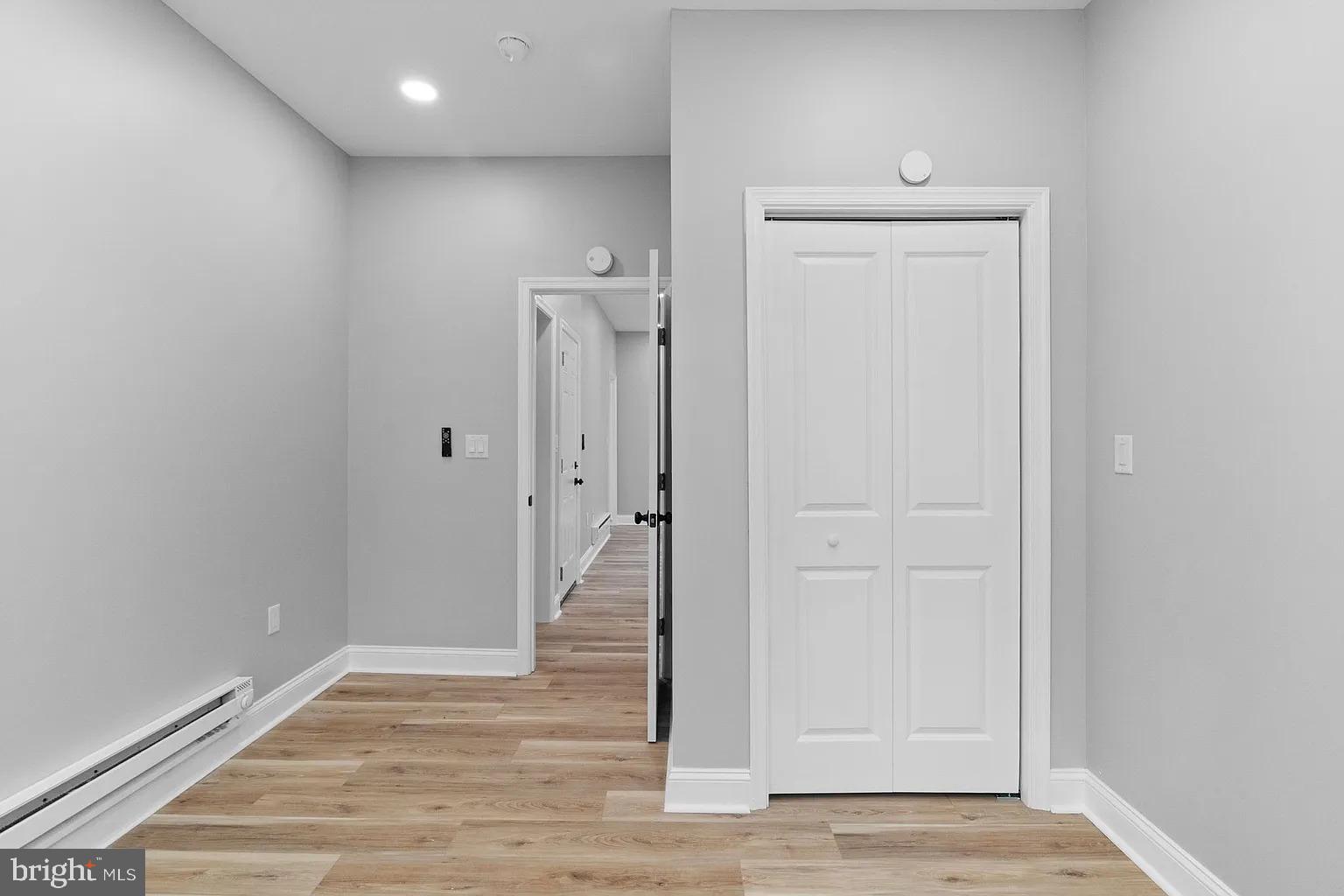 6232 Reedland Street, Unit 1 Philadelphia, PA 19142 - Photo 8 of 8 a view of a hallway with wooden floor