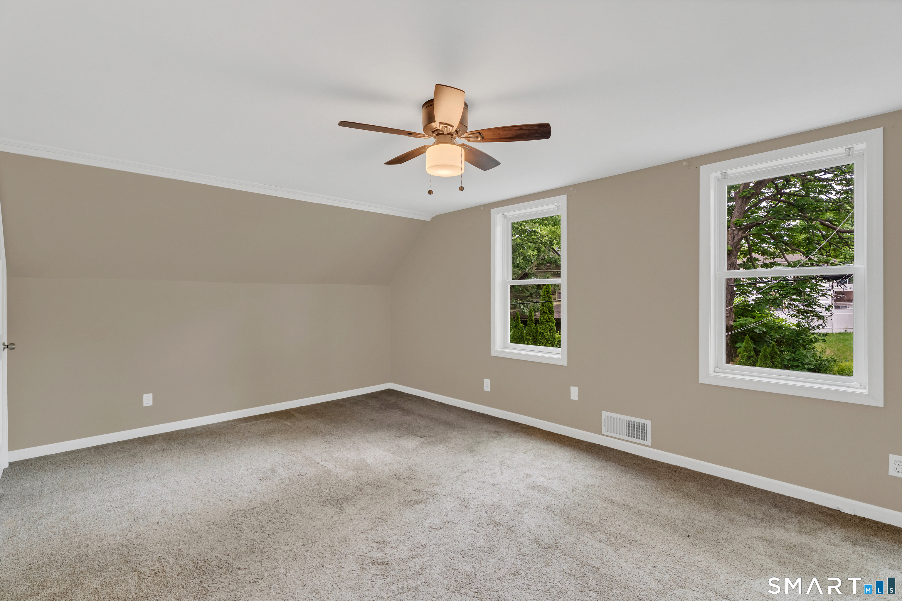 75 Summit Street Norwich, CT 06360 - Photo 33 of 40 an empty room with a window and a fan
