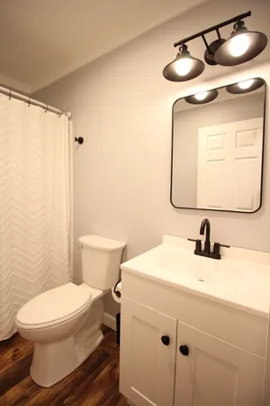 a bedroom with a bed and wall painting
