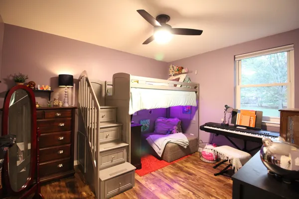 a view of a patio with table and chairs