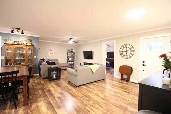a living room with furniture and a flat screen tv