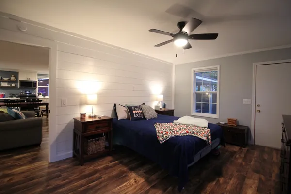 a bedroom with a bed and a flat screen tv