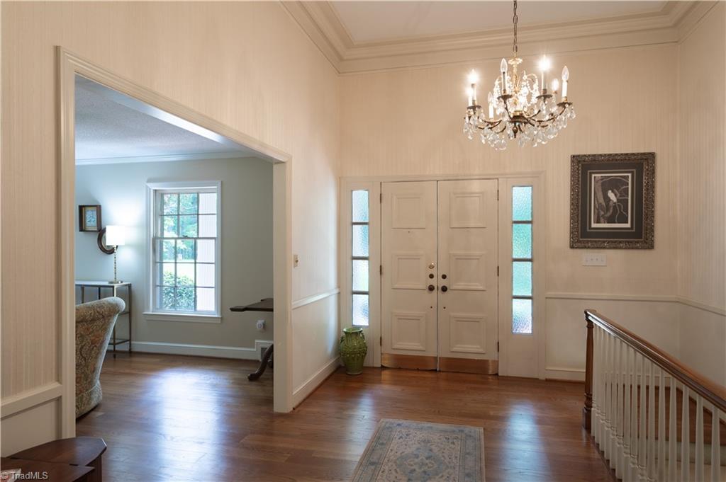 112 Magnolia Road Lexington, NC 27292 - Photo 10 of 46 The formal living and dining rooms face the front of the home. This view from the delightful dining room offers a peek through a cased opening into the formal living room.