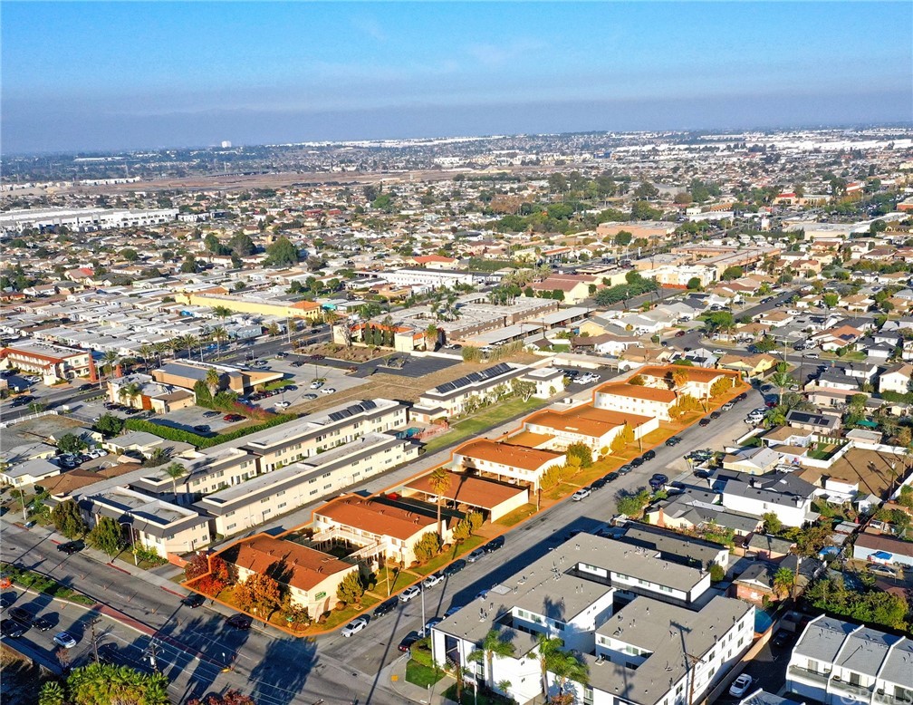 an aerial view of residential building with parking