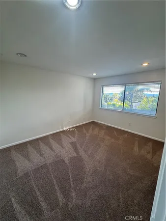 en empty room with windows