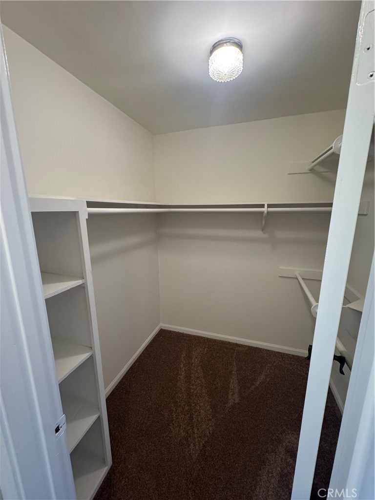 11445 Etiwanda Avenue Porter Ranch, CA 91326 - Photo 22 of 28 a view of walk in closet with empty racks