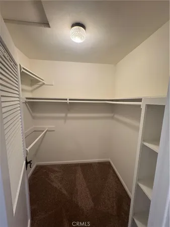 a view of an empty walk in closet