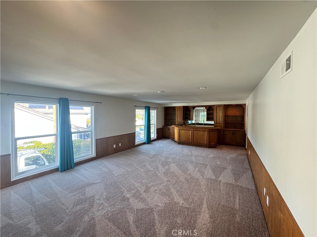 11445 Etiwanda Avenue Porter Ranch, CA 91326 - Photo 25 of 28 a view of empty room with a fireplace and window