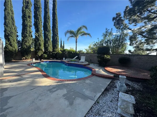 a view of a swimming pool with a patio