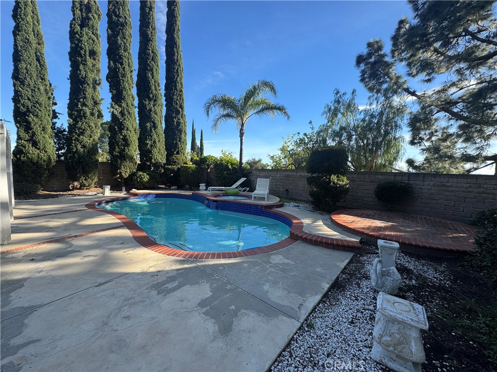 11445 Etiwanda Avenue Porter Ranch, CA 91326 - Photo 27 of 28 a view of a swimming pool with a patio