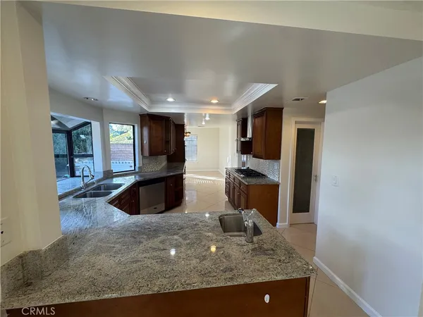 a view of a kitchen with a sink