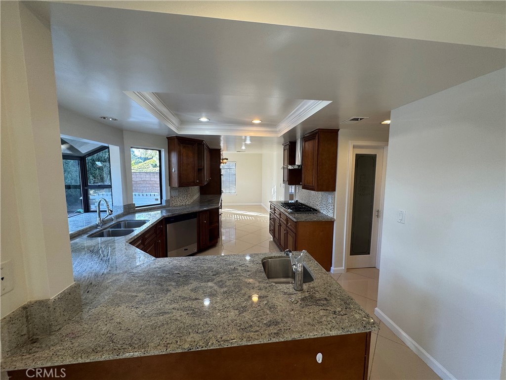 11445 Etiwanda Avenue Porter Ranch, CA 91326 - Photo 10 of 28 a view of a kitchen with a sink